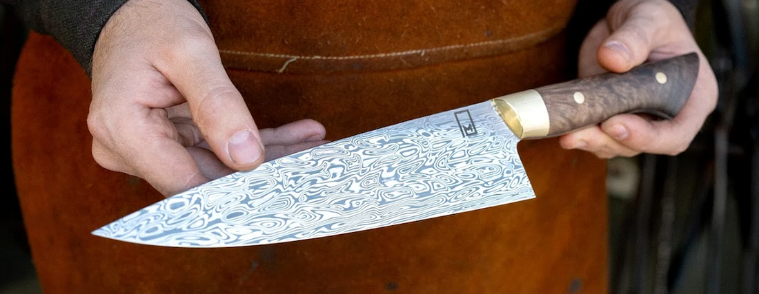 Damasteel stainless Damascus chef knife blade by Monolith Knives.